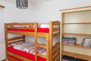 a bunk bed room with two bunk beds at Pic-Chaussy B14 in Les Mosses
