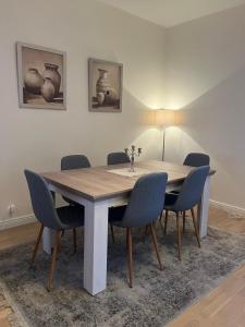 a dining room with a table and chairs at Rose Apartment in Pärnu