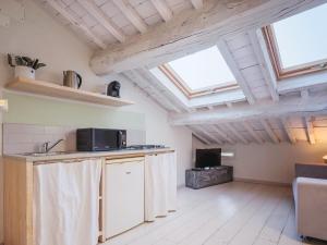 a kitchen with two skylights and a counter top at Residenza degli Artisti Apartments in Lucca