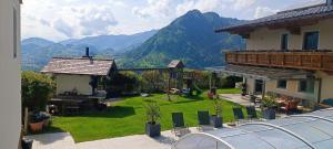 a balcony of a house with a view of the mountains at Appartementhaus Eisbauer in Sankt Johann im Pongau