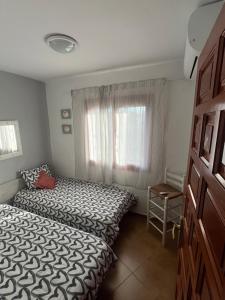 Posteľ alebo postele v izbe v ubytovaní Apartamento Urb Oasis Park II Denia, las Marinas