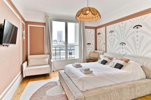 Cama o camas de una habitación en Appartement proche 17ème arrondissement - Neuilly