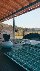 a table with a green table cloth on top of it at CASA QUERCU in Sykia Chalkidikis