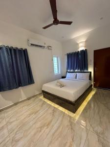 Postel nebo postele na pokoji v ubytování La Tamara Auroville