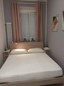 Postel nebo postele na pokoji v ubytování Rho Fiera Onit's Apartment + 11 fotografií