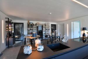 a kitchen with a counter and a dining room at The Window in Bellinzona