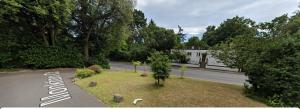 a view of a road with a house in the background at Beautiful 3 bedroom Apartment in Bournemouth in Bournemouth