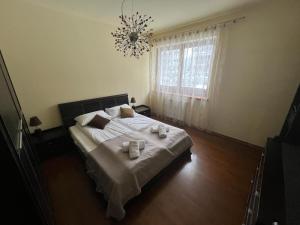 a bedroom with a bed with two candles on it at Apartament z widokiem na Czantorię w Zeta Park in Ustroń