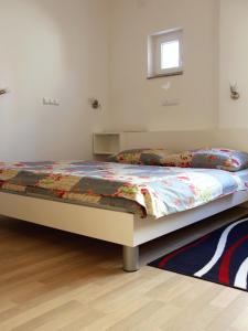 Posteľ alebo postele v izbe v ubytovaní Apartmani Nighty Night