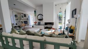 a living room with a couch and a table at Villa Dar Céleste in Essaouira
