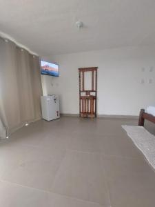 Μια τηλεόραση ή/και κέντρο ψυχαγωγίας στο Casa em Frente ao Mar