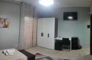 TV a/nebo společenská místnost v ubytování Guest House Elettra