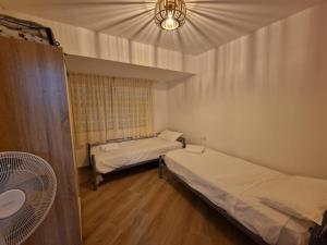 Postel nebo postele na pokoji v ubytování Stay In Sunrise Campello