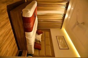 an overhead view of a bed in a room at HOTEL PEARL WOOD (A unit of olive hospitality group) in Zirakpur