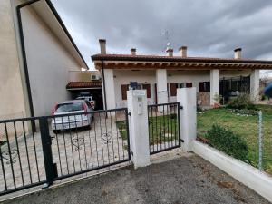a fence in front of a house at In campagna in Arcade
