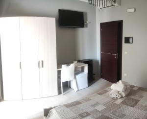TV a/nebo společenská místnost v ubytování Guest House Elettra