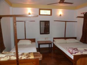 Llit o llits en una habitació de Forest Hideaway Resort Pvt Ltd