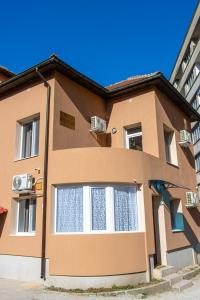 a building with a large window on the side of it at Navial in Gabrovo