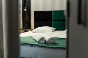 Posteľ alebo postele v izbe v ubytovaní Elegant Apartments