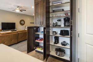 a kitchen with a black refrigerator in a living room at Entrada at Moab 635 in Moab