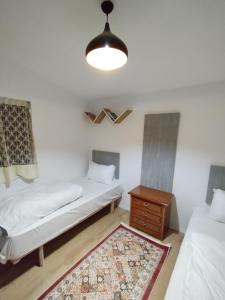 Postel nebo postele na pokoji v ubytování 2 single Bedroom Tirana