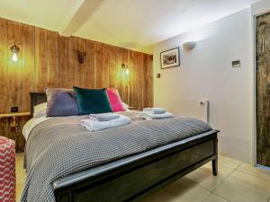 a bedroom with a bed with towels on it at 1 bed property in St Ives 85786 in St Ives