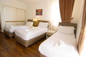 Postel nebo postele na pokoji v ubytování Chateau Linza Resort