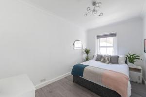 Cama ou camas em um quarto em Cosy Two Bedroom Apartment in Oxford Circus-Fitzrovia