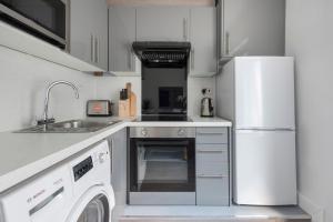 A cozinha ou cozinha compacta de Cosy Two Bedroom Apartment in Oxford Circus-Fitzrovia