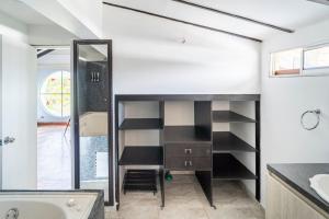 a bathroom with a sink and a bath tub at 3 Story Penthouse with 2 parking spaces in Laureles in Medellín +61 photos