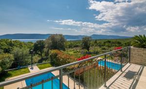 a balcony with a view of the water at Villa Linna with seaview in Pinezici