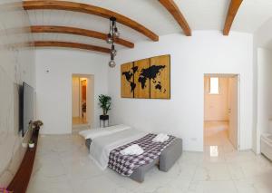 a bedroom with a bed and a couch in a room at extra luxury apartment salerno center in Salerno