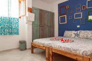 Ένα ή περισσότερα κρεβάτια σε δωμάτιο στο Casa Carlotta Maio +143 φωτογραφίες