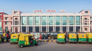 a group of small vehicles parked in front of a building at Aditya Inn Near New Delhi Railway Station Paharganj in New Delhi