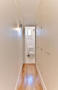 a bathroom with a toilet and a window at Luxurious Flat next Paris - Neuilly - II in Neuilly-sur-Seine