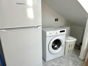 a white refrigerator and a washing machine in a room at Santa Úrsula 21 in Costa Calma