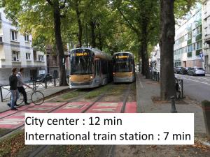 two city trolleys are parked on a city street at Albert Molière in Brussels