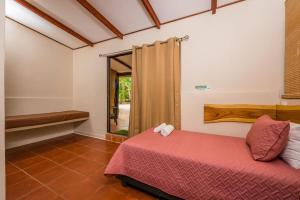 Postel nebo postele na pokoji v ubytování Casa Tropical Playa Grande + 37 fotografií