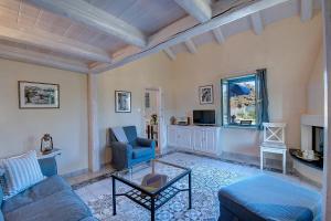 a living room with a couch and a table at Rhodian Gaea Villa in Theologos