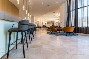 a row of chairs and tables in a lobby at Park Plaza Histria Pula in Pula