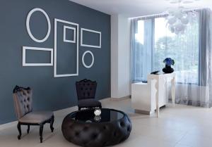 a living room with two chairs and a table at Park Plaza Histria Pula in Pula