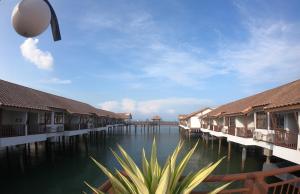 a view of the water with houses and buildings at Tokido Private Water Chalet PD in Port Dickson