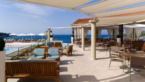 a restaurant with a view of the ocean at Park Plaza Verudela Pula in Pula