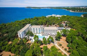 an aerial view of a resort with a pool at Park Plaza Arena Pula in Pula