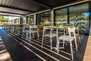 a row of tables and chairs on a patio at Park Plaza Arena Pula in Pula