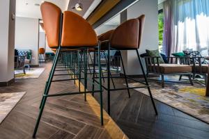 a group of chairs sitting in a room at Park Plaza Arena Pula in Pula