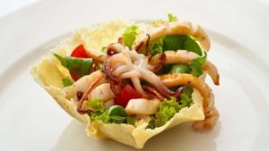 a sandwich with lettuce and shrimp on a white plate at Park Plaza Arena Pula in Pula