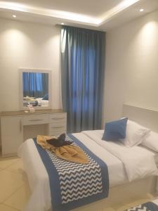 A bed or beds in a room at Sharm Hills