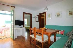 Televízia a/alebo spoločenská miestnosť v ubytovaní Sa Calma Beach House
