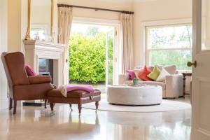 a living room with two chairs and a coffee table at Dromard in Kenmare